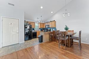 a kitchen with a table and a dining room at Heavenly Hideaway Condo in Branson West