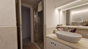 Ванная комната в Villaggio Est a Capo Coda Cavallo San Teodoro