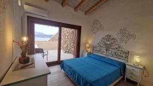 Кровать или кровати в номере Villaggio Est a Capo Coda Cavallo San Teodoro