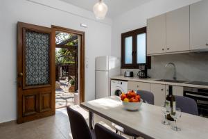 A kitchen or kitchenette at Ariadni Villas Faliraki