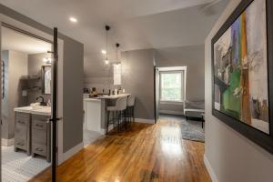 a kitchen and living room with a sink and a counter at Lovely 1BR in Historic Ludlow - Behind the Art Shop in Ludlow +10 photos