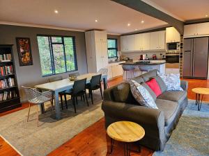 a living room with a couch and a table at Riverview House Sedgefield in Sedgefield