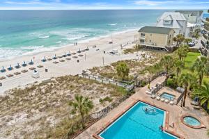 an overhead view of the beach and swimming pool at a resort at Commodore Resort #704 by Book That Condo in Panama City Beach