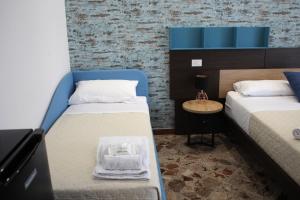 Postel nebo postele na pokoji v ubytování B&B DEGLI ANGELI