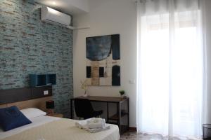 TV a/nebo společenská místnost v ubytování B&B DEGLI ANGELI