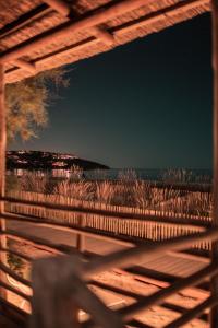 a view of the beach from a wooden fence at Toison D'or in Saint-Tropez