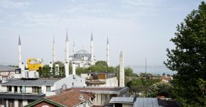 a view of the blue mosque from the roofs of buildings at Aurora Eco Hotel in Istanbul