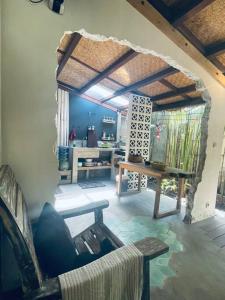 a living room with a couch and a table at Studio On Air in Gili Islands