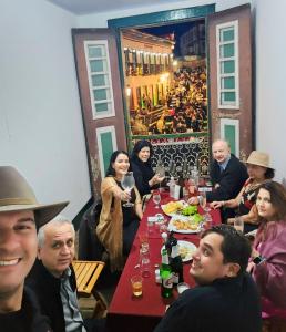 a group of people sitting at a table eating food at Estância do Biribiri in Diamantina