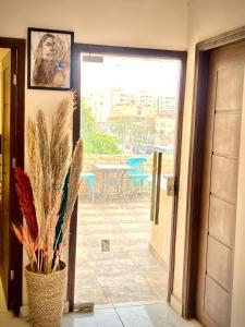 an open door with a view of a patio at 4 Pyramids inn in Cairo