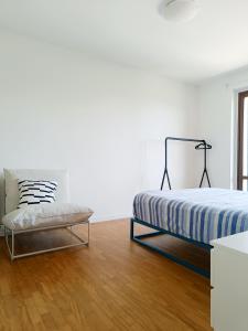 Katil atau katil-katil dalam bilik di Sant'Erminio comfort rooms