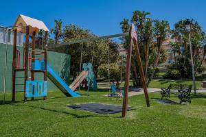 un parque con un área de juegos con tobogán en Casa Oliver holiday villa Tarifa, garage, pool, en Tarifa
