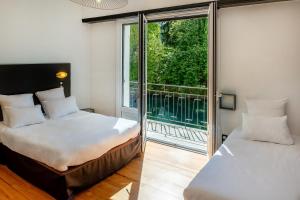 Ένα ή περισσότερα κρεβάτια σε δωμάτιο στο APPARTEMENTS VINUALES +18 φωτογραφίες