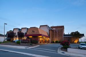 a hotel on a street with a parking lot at Hawthorne Inn & Conference Center in Winston-Salem