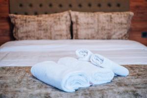 a pile of towels sitting on top of a bed at Mysia Olympos Hotel in Bursa