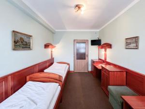 Postel nebo postele na pokoji v ubytování Hotel Závrší