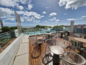 Uma varanda ou terraço em Linda cobertura vista mar