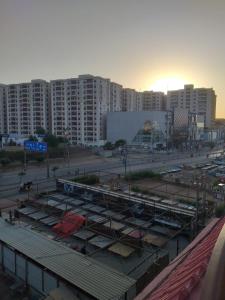 a large parking lot in a city with tall buildings at Second Home Guest House Near Agha, Khan Airport in Karachi