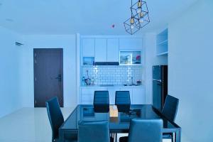 a kitchen with a dining room table and chairs at Family Holiday Fun APT Netflix by MESA in Nagoya