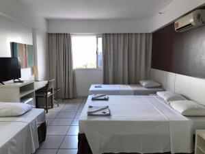 Cama ou camas em um quarto em Apartamento Le Jardin