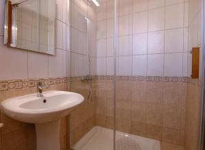a bathroom with a sink and a shower at Phaedrus Living: Universal City Flat Alina in Paphos City +7 photos