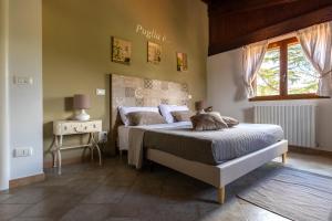 Postel nebo postele na pokoji v ubytování B&B Villa Adriana
