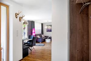 a living room and dining room with a table and chairs at Mosers Ferienwohnung am Sonnenhang in Jenbach