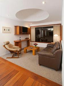 a living room with a couch and a table at El Crater in San Antonio