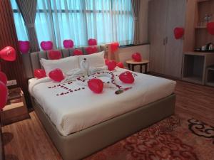 Ένα ή περισσότερα κρεβάτια σε δωμάτιο στο Hotel Badrinath