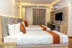 Ένα ή περισσότερα κρεβάτια σε δωμάτιο στο Hotel Badrinath