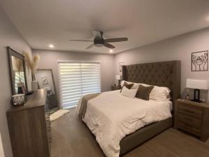 a bedroom with a bed and a ceiling fan at Cozy 2 Bedroom Modern Farmhouse in Miami in Tamiami +19 photos