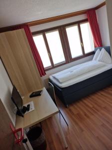 Postel nebo postele na pokoji v ubytování Hotel Alpha Thun