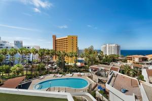 an aerial view of a resort with a swimming pool at Las Flores 407 in Playa Fañabe