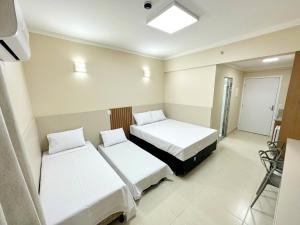 Cama ou camas em um quarto em diRoma Spazzio - Acesso Acqua Park mais 3 fotos
