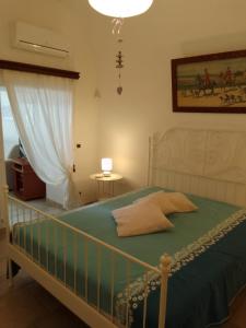 Postel nebo postele na pokoji v ubytování Masseria Ricci