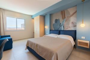 Postel nebo postele na pokoji v ubytování Antares Rooms and Suites
