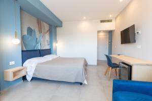 TV a/nebo společenská místnost v ubytování Antares Rooms and Suites