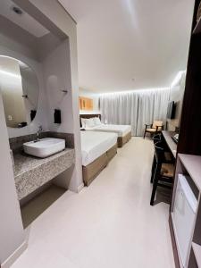 Postel nebo postele na pokoji v ubytování Smart Hotel João Pessoa