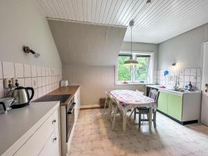 a kitchen with a table and a dining room at frau Harms Kaffeehaus in Soderstorf
