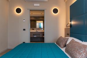 Postel nebo postele na pokoji v ubytování Hotel Porto Roca