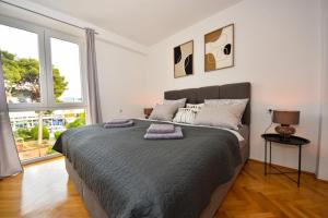 Postel nebo postele na pokoji v ubytování Apartman Lora