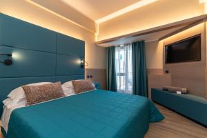 Postel nebo postele na pokoji v ubytování Hotel Porto Roca