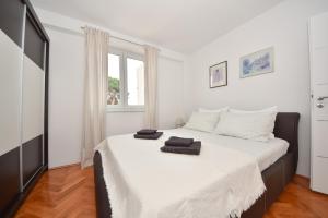 Postel nebo postele na pokoji v ubytování Apartman Lora