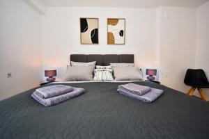 Postel nebo postele na pokoji v ubytování Apartman Lora