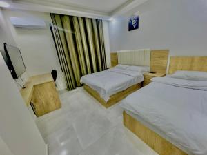 Postel nebo postele na pokoji v ubytování رويال جروب اربد Royal Group Hotel