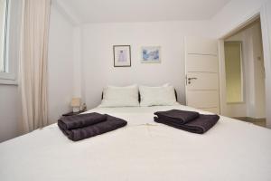Postel nebo postele na pokoji v ubytování Apartman Lora