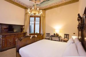 A bed or beds in a room at Antico Portego