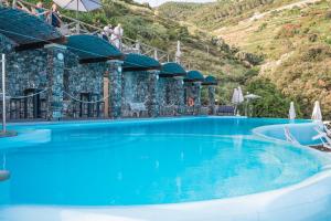 Bazén v ubytování Hotel Porto Roca nebo v jeho okolí