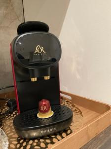 a coffee maker sitting on top of a table at Kezy appartement 4 personne bébé in Reims