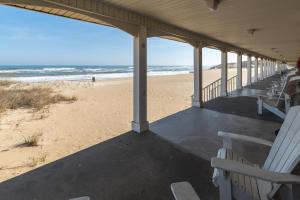 a building with a view of the beach at Cavalier by the Sea in Kill Devil Hills